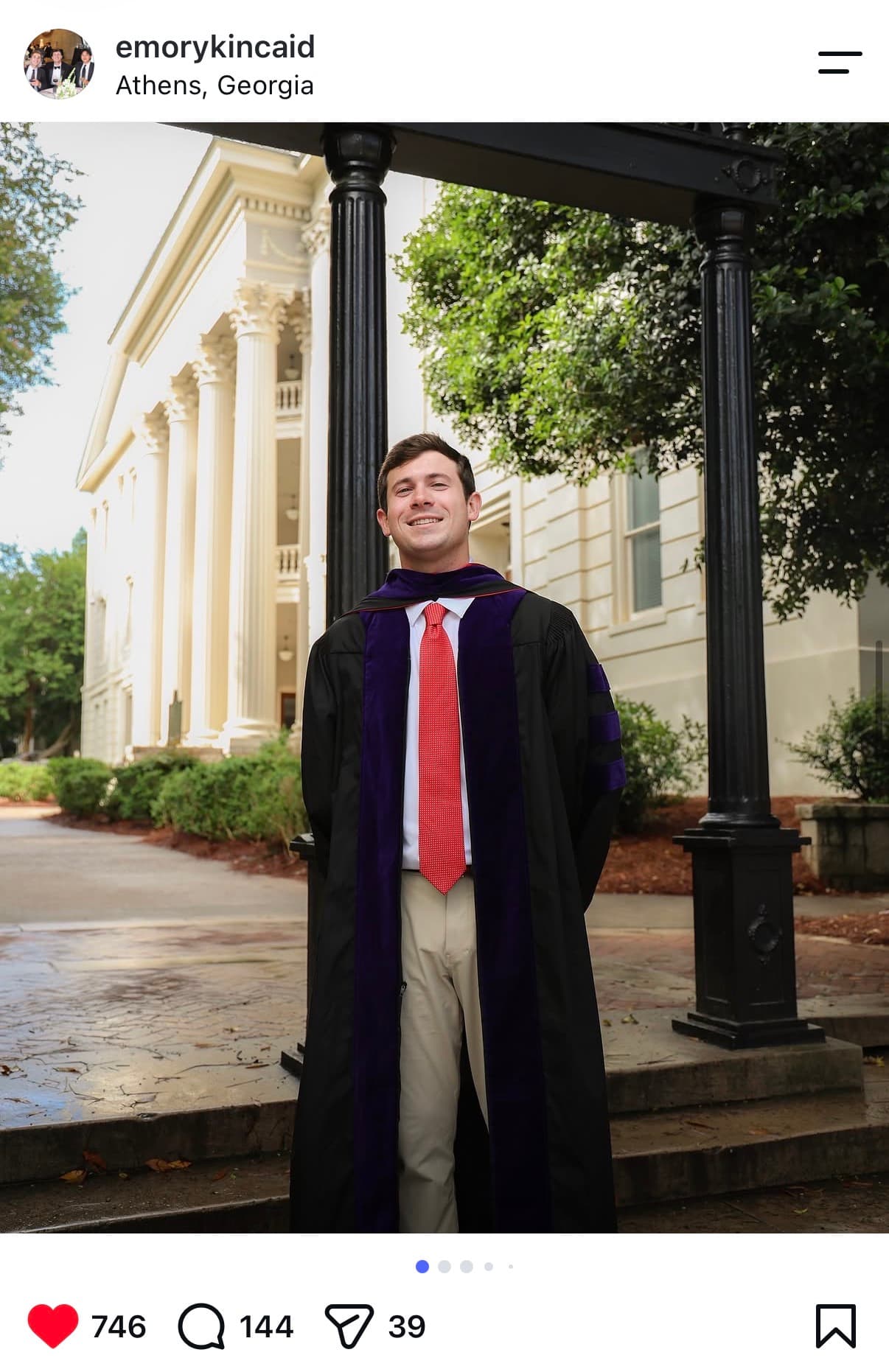 Instagram post: doctoral graduate in full regalia under the UGA Arch in Athens, Georgia — 746 likes